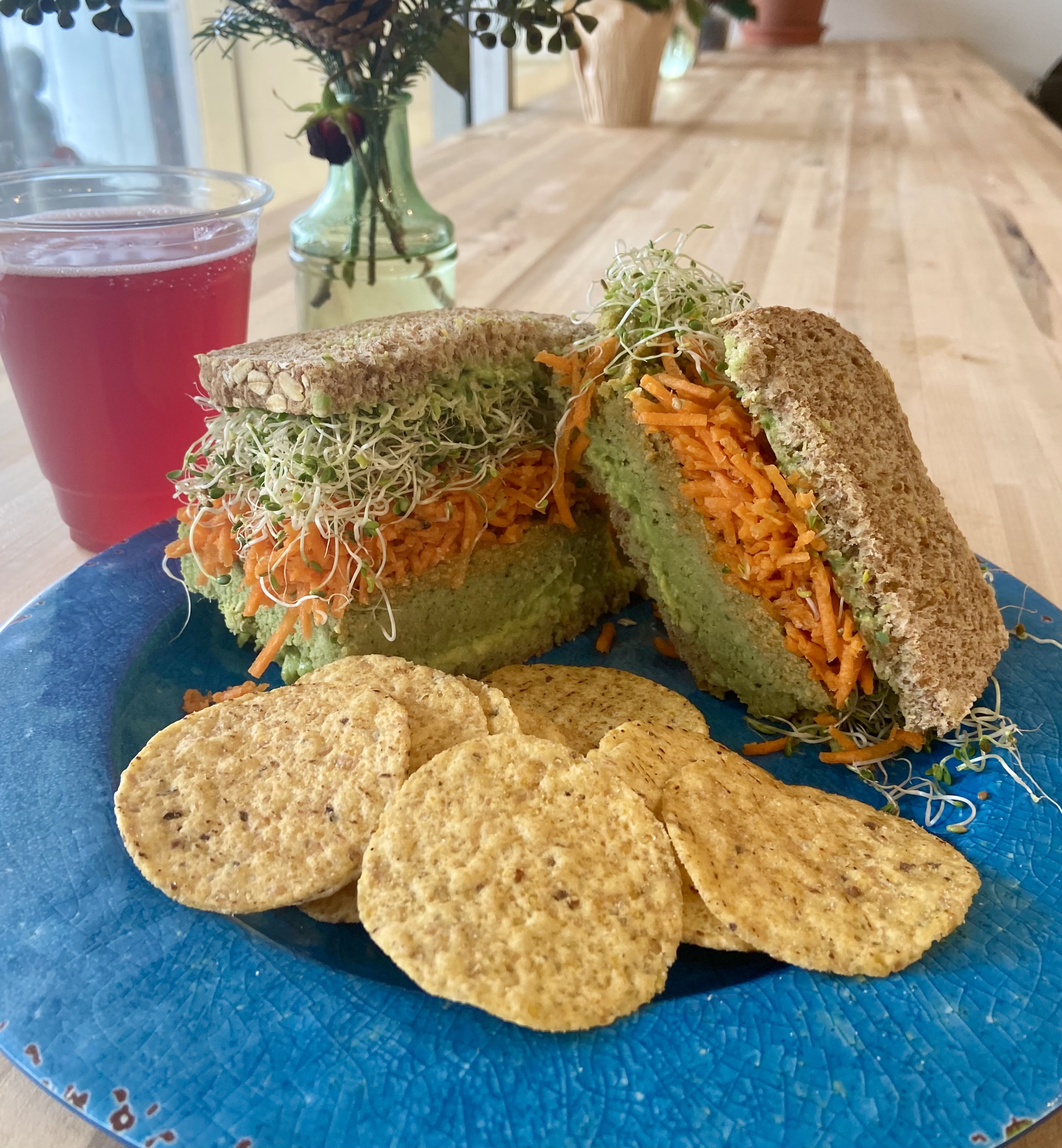 Falafel Sandwich with melted white cheddar, avocado and sprouts on 7-grain bread