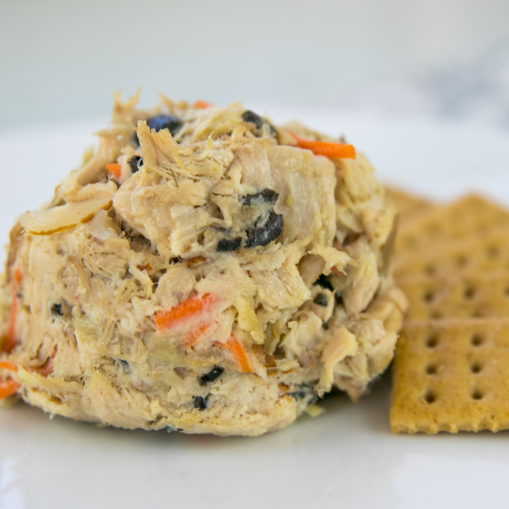 Scoop of the original turkey salad with black olives, carrots and almonds
