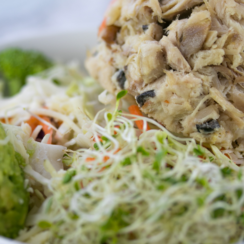 Fresh chicken salad plated with sprouts at Another Beautiful Day